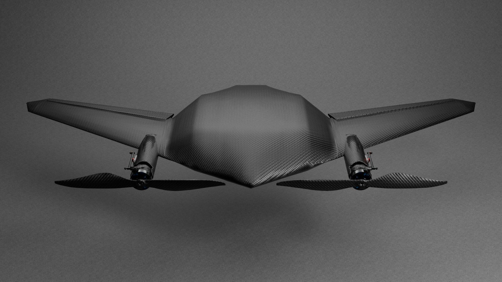 Front elevation of the Aerzoom aircraft with its rotors level, lit against a grey studio backdrop.